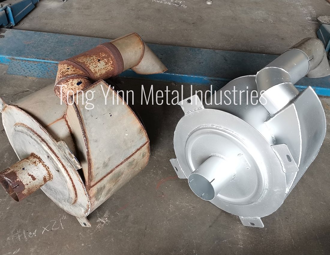 Cowl spiral muffler with top pipe